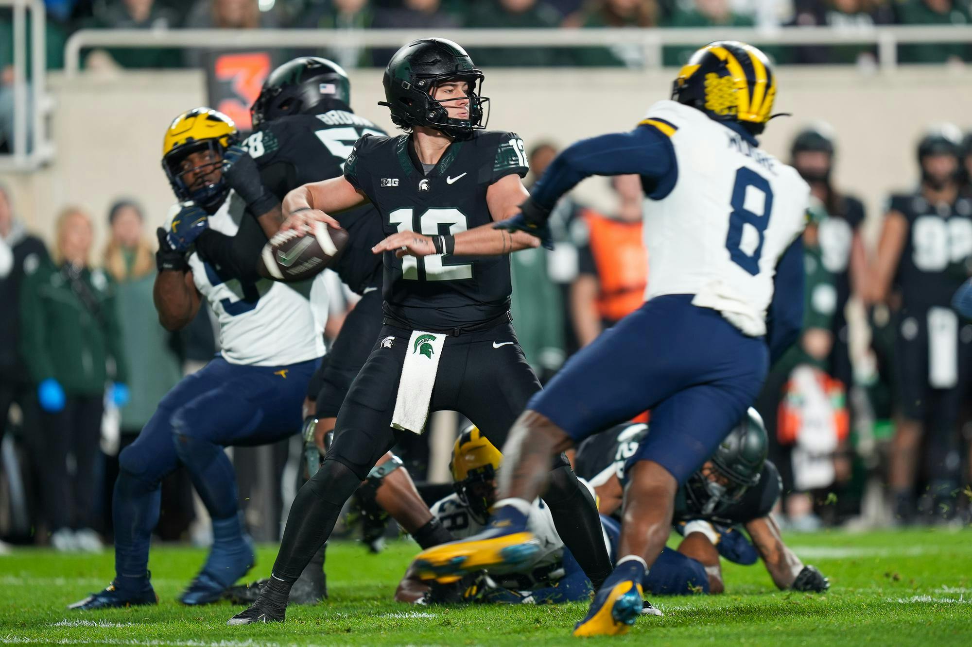 <p>Redshirt freshman quarterback Katin Houser (12) preparing to throw the ball during a game against University of Michigan at Spartan Stadium on Oct. 21, 2023.</p>