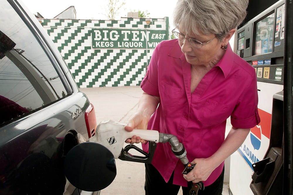 	<p>Williamston, Mich., resident Sally Harwood puts gas into her car June 9, 2013, at the Admiral gas station, 1120 E. Grand River Ave. The average gas price in Michigan is $4.25, which is the highest in the midwest.</p>