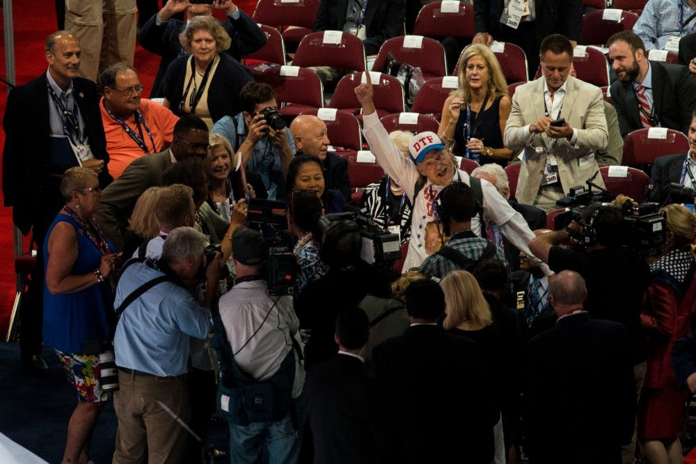 A man dances while a band plays music during an intermission at the Republican National Convention on July 18, 2016 at Quicken Loans Arena in Cleveland, Ohio.