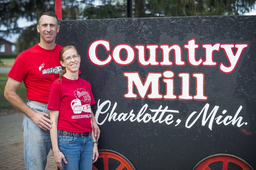 <p>Steve Tennes, the owner of Country Mill Orchard, and his wife, Bridget Murphy Tennes, pose for a picture on Sept. 27 at Country Mill Orchard in Charlotte, Michigan. Steve Tennes and Country Mill Orchard returned to the East Lansing Farmers Market on Sept. 24, after a federal judge ruled in his favor.</p>