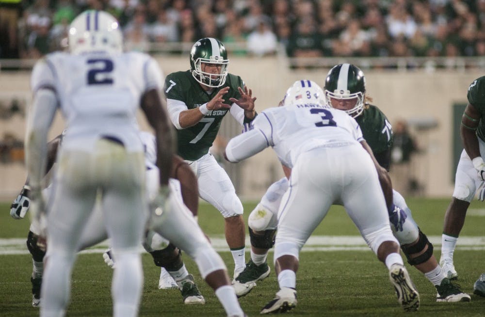 Senior quarterback Tyler O'Connor receives a snap from senior center Kodi Kieler during the home football game against Furman on Sept. 2, 2016 at Spartan Stadium.  O'Connor passed for 190 yards and threw three touchdown passes. 