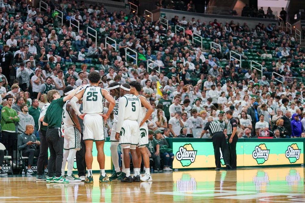 <p>The Spartans huddle in front of the fans during a timeout in a game against James Madison University at the Breslin Student Events Center on Nov. 6, 2023.</p>