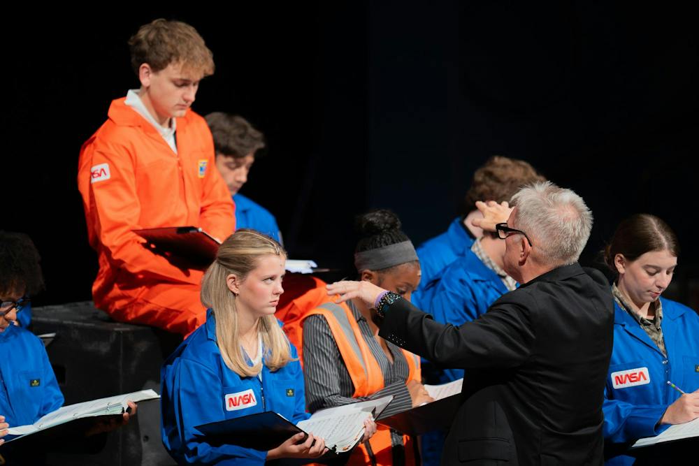 <p>A conductor leads Michigan State students during rehearsal for the upcoming production of "Discovery" at Wharton Center in East Lansing, Mich., on Tuesday, Sept. 22, 2026.</p>