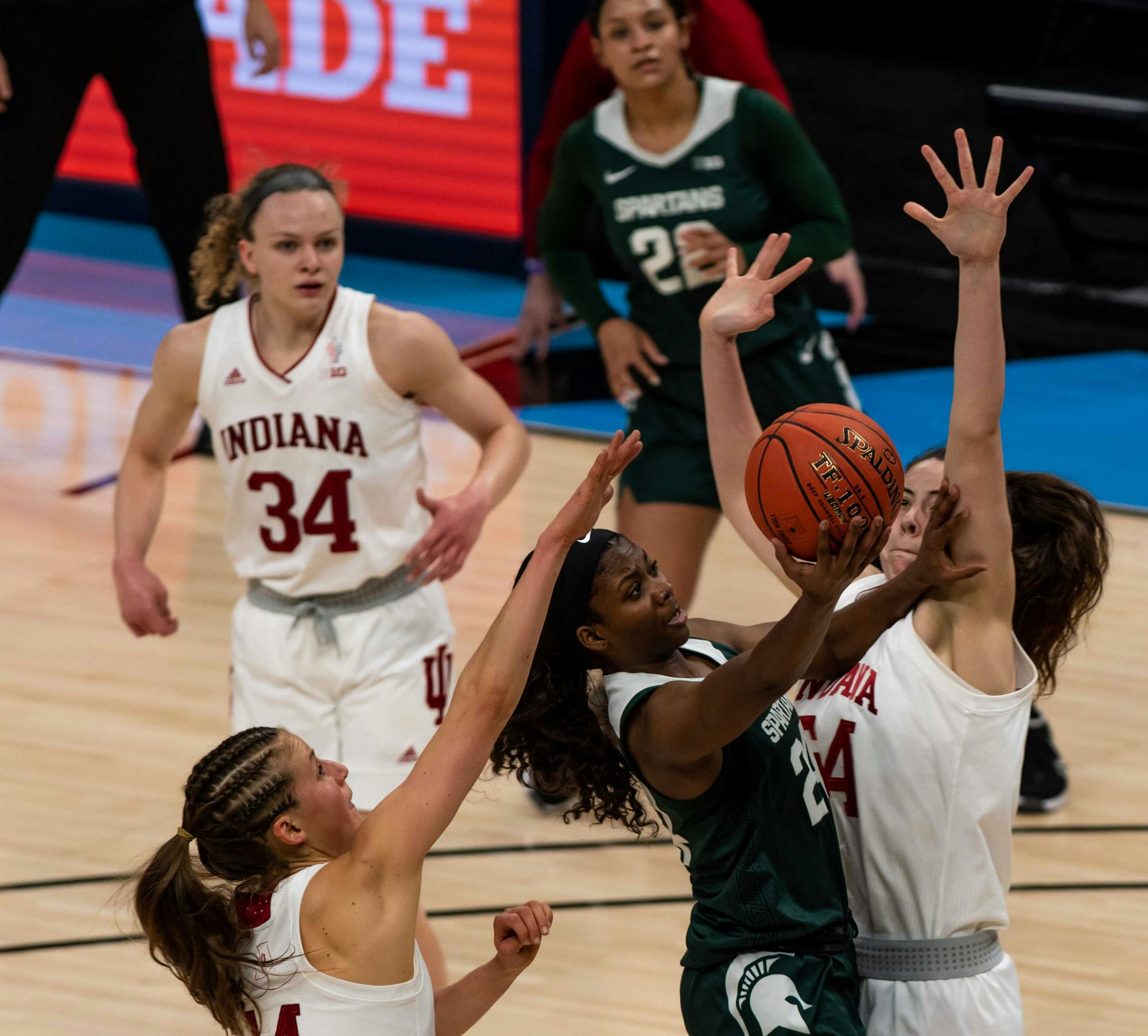 <p>Clouden fights off Indiana defenders to score during the second quarter. The Spartans will advance to the semifinals of the Big Ten Tournament after defeating the Hoosiers 69-61 at Bankers Life Fieldhouse. Shot on March 11, 2021.</p>