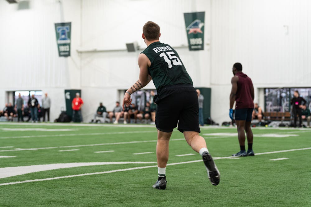 <p>Michigan State graduate student Anthony Russo launching the football up the field during Pro Day on-field position drills, on Mar. 16, 2022 at the Duffy Daugherty Indoor Football Building.</p>