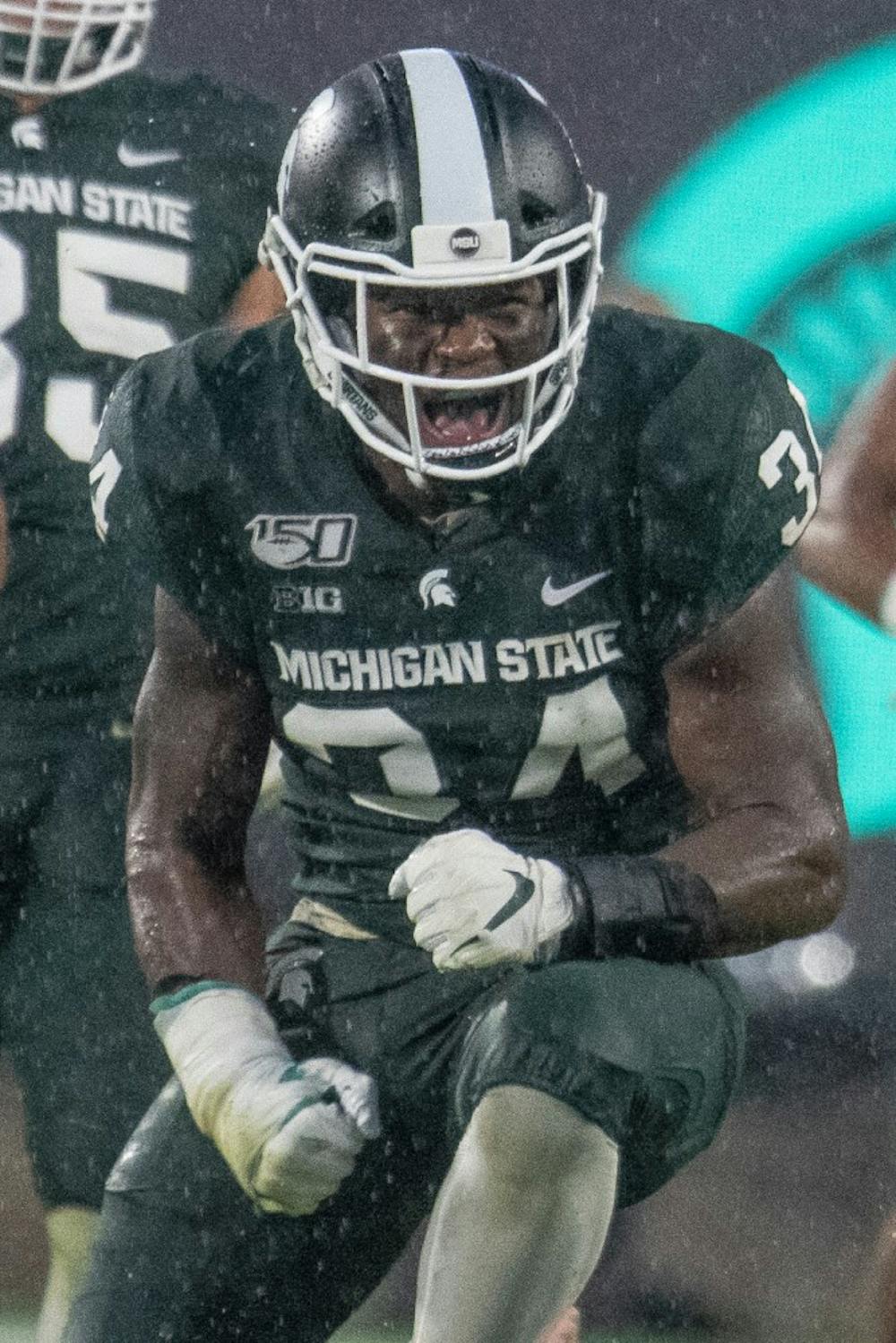 <p>Junior linebacker Antjuan Simmons (34) celebrates during the game against Penn State on Oct. 26, 2019 at Spartan Stadium. The Spartans fell to the Nittany Lions, 28-7.</p>