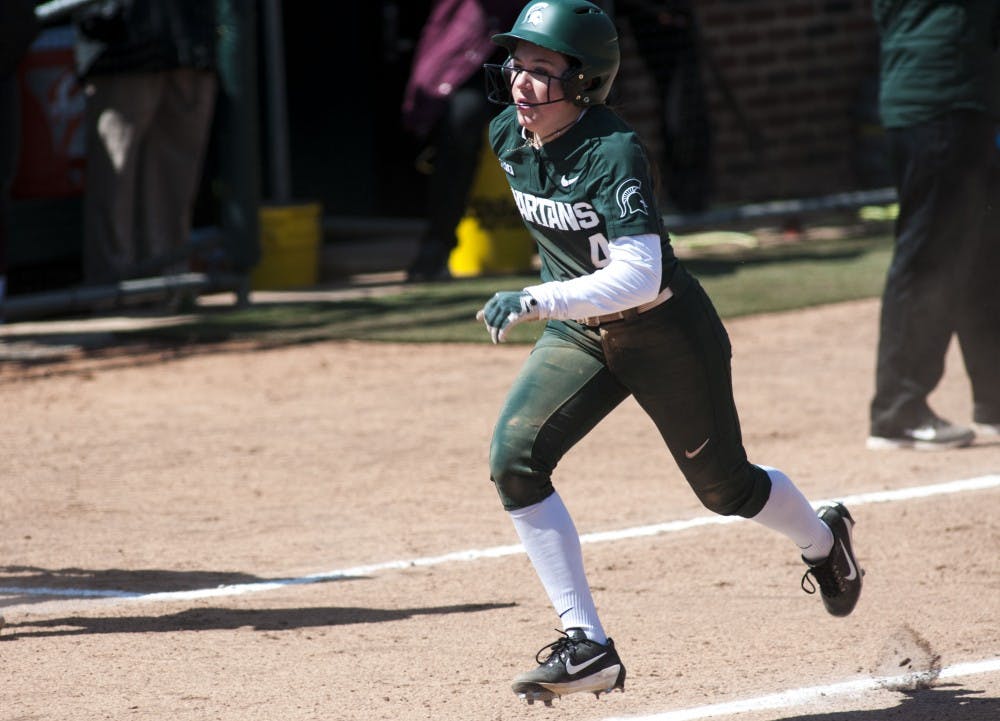 <p>Freshman outfielder Katie Quinlan (4) runs during the game against Minnesota April 8, 2018 at Secchia Stadium. The Vikings defeated the Spartans, 6-2. (Annie Barker | State News)</p>