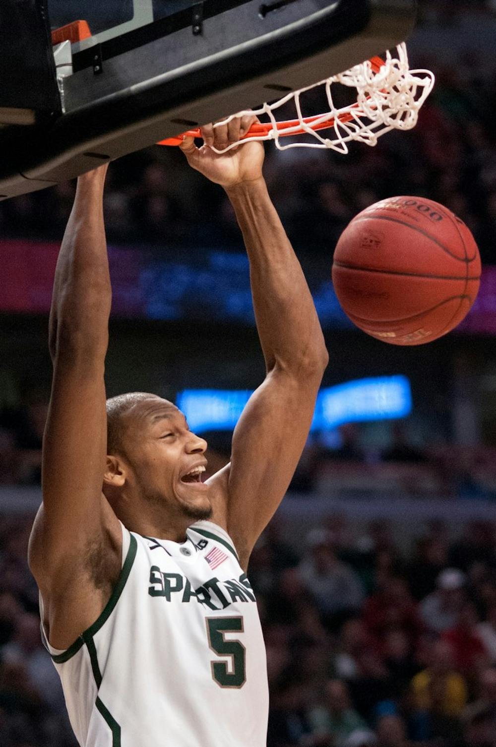 	<p>Junior forward Adreian Payne dunks the ball during the second round of the Big Ten Tournament against Iowa on March 15, 2013, at United Center in Chicago, Ill. Payne was the leading scorer for the Spartans with 18 points helping them beat the Hawkeyes, 59-56. Natalie Kolb/The State News</p>