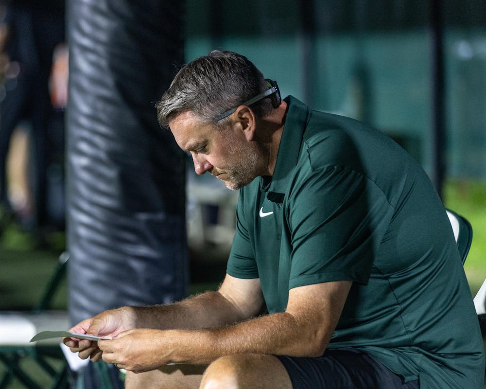 <p>Michigan State head women's soccer coach, Jeff Hosler, looks over his teams stats after they played Xavier University in DeMartin Stadium in East Lansing, Mich., on Aug. 12, 2026.</p>