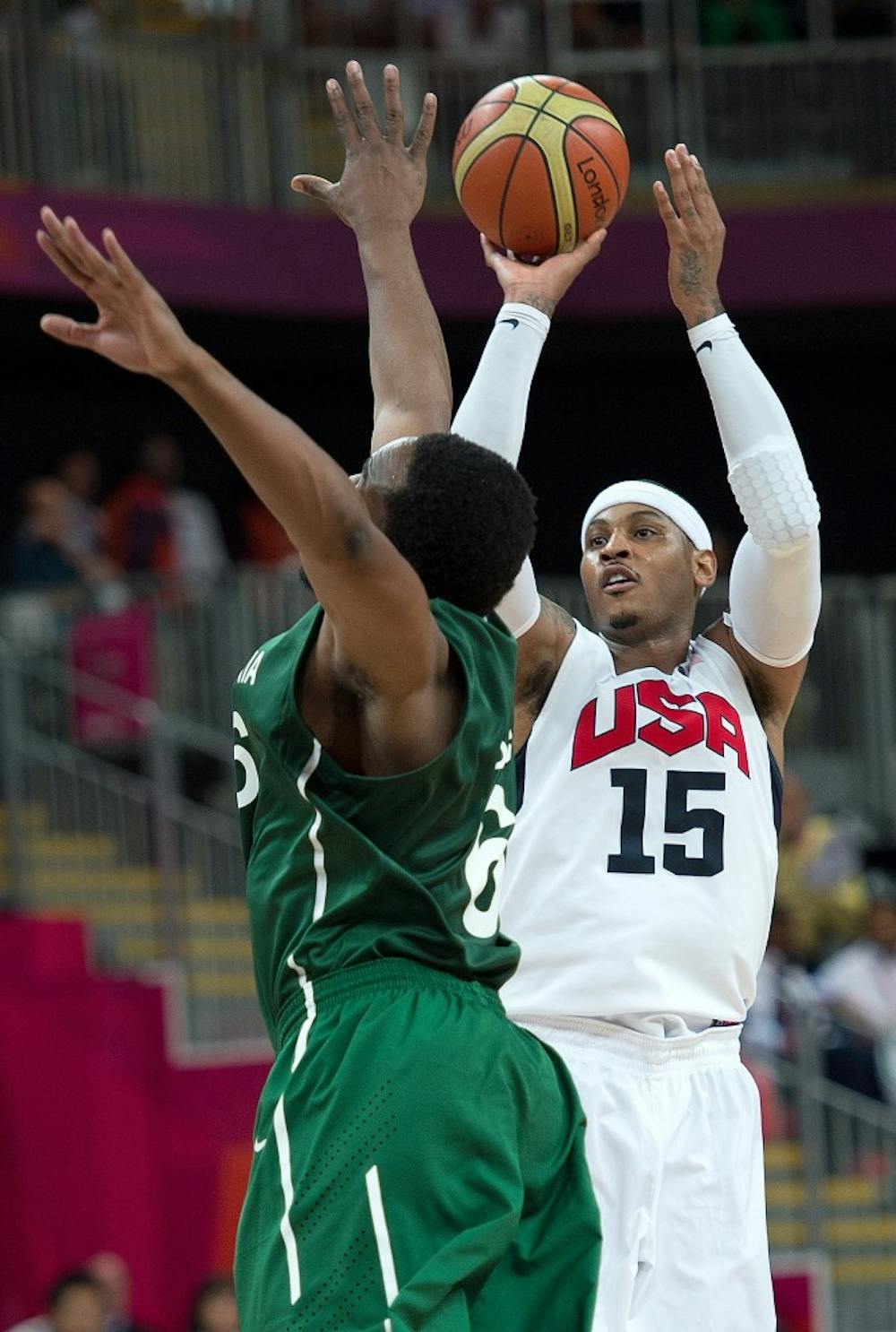 USA's Carmelo Anthony (15) scores over Nigeria's Ike Diogu (6) during their game at the Olympic Park Basketball Arena during the 2012 Summer Olympic Games in London, England, Thursday, August 2, 2012. (Harry E. Walker/MCT)
