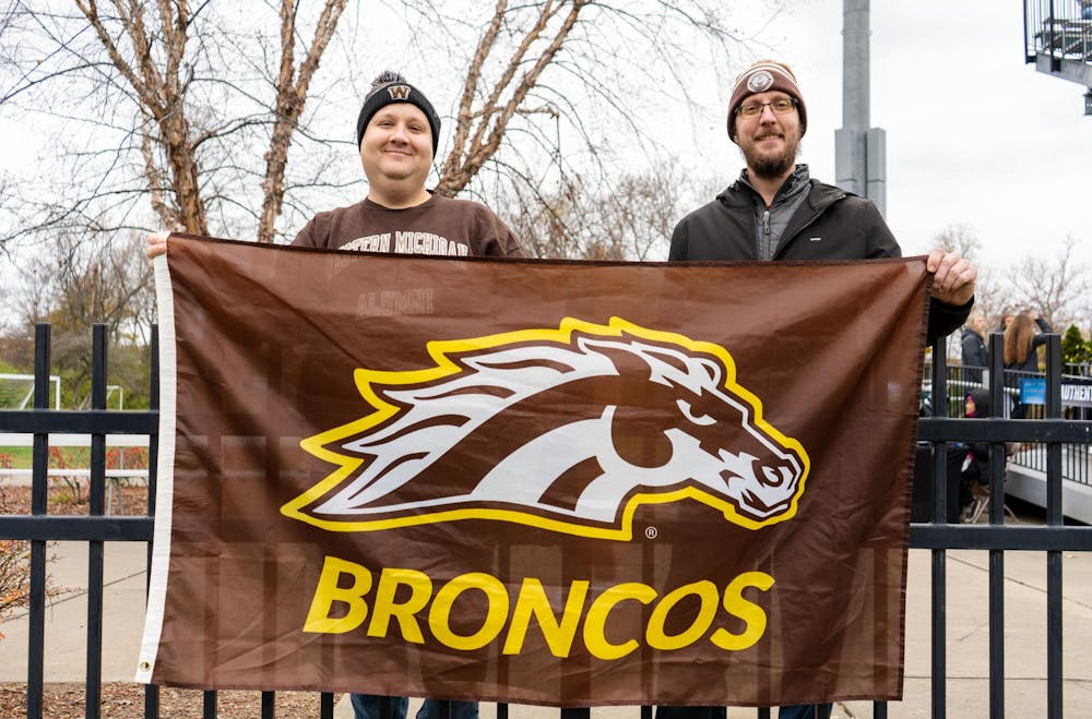 <p>Western Michigan University fans hold a Broncos flag before the NCAA soccer tournament game between MSU and WMU on Nov. 16, 2024. The Spartans defeated the Broncos, 3-1.</p>