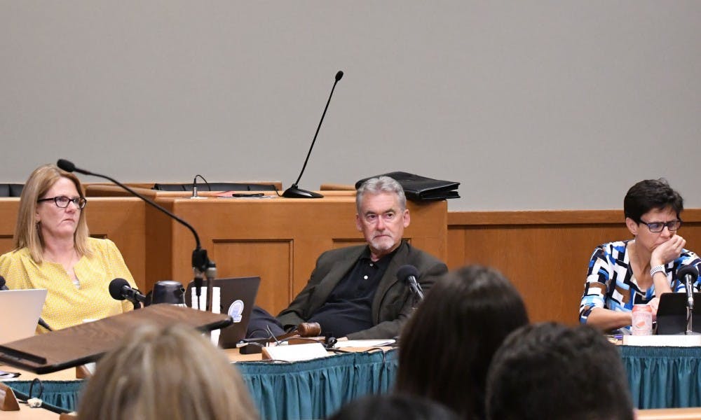<p>Council member Shanna Draheim (left first), Mayor Mark Meadows (left second), Council member Ruth Beier (right second) and Council member Aaron Stephens (right first) at the July 16 City of East Lansing Council Meeting.</p><p></p>