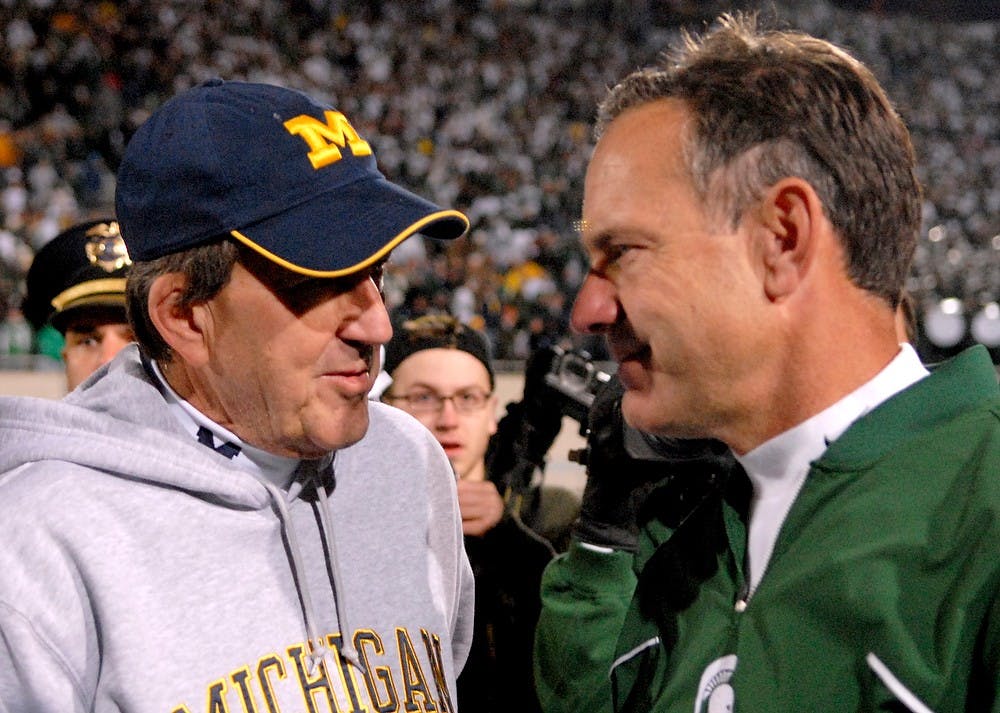 <p>Michigan State head coach Mark Dantonio and Michigan head coach Lloyd Carr shake hands after the Spartans lost to the Wolverines on Nov. 3, 2007, at Spartan Stadium. The Spartans lost, 28-24. Jason Chiou/The State News</p>