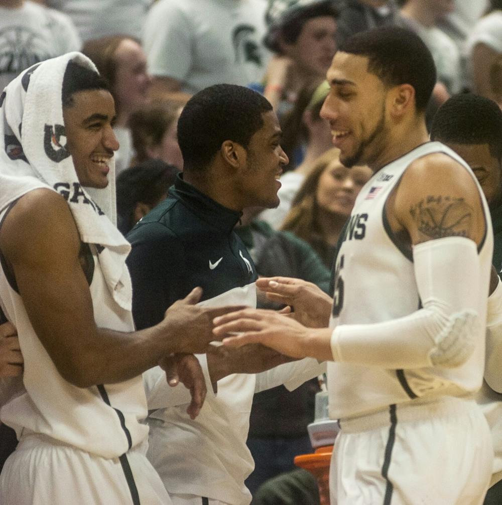 	<p>Sophomore guard/forward Denzel Valentine, right, celebrates his 3-point shot with sophomore guard Gary Harris during the game against Penn State on Feb. 6, 2014, at Breslin Center. The Spartans defeated the Nittany Lions, 82-67. Erin Hampton/The State News</p>