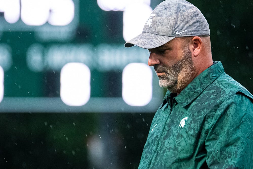 <p>Men&#x27;s soccer head coach Damon Rensing walks across the field prior to the start of the game. Michigan State men&#x27;s soccer team defeated Duquesne 1-0 on Sept. 21, 2021 in East Lansing.</p>