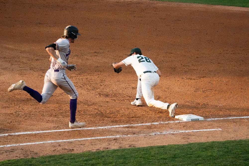 <p>MSU first baseman Brock Vradenburg stretches to complete a catch at first base at McLane Baseball Stadium on Friday, April 14, 2023. Vradenburg leaned too far off the base, and the runner was ruled safe.</p>