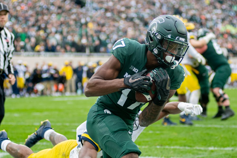 <p>Redshirt sophomore wide receiver Tre Mosley hauls in a pass during the Spartans&#x27; 37-33 win against the Wolverines on Oct. 30, 2021.</p>