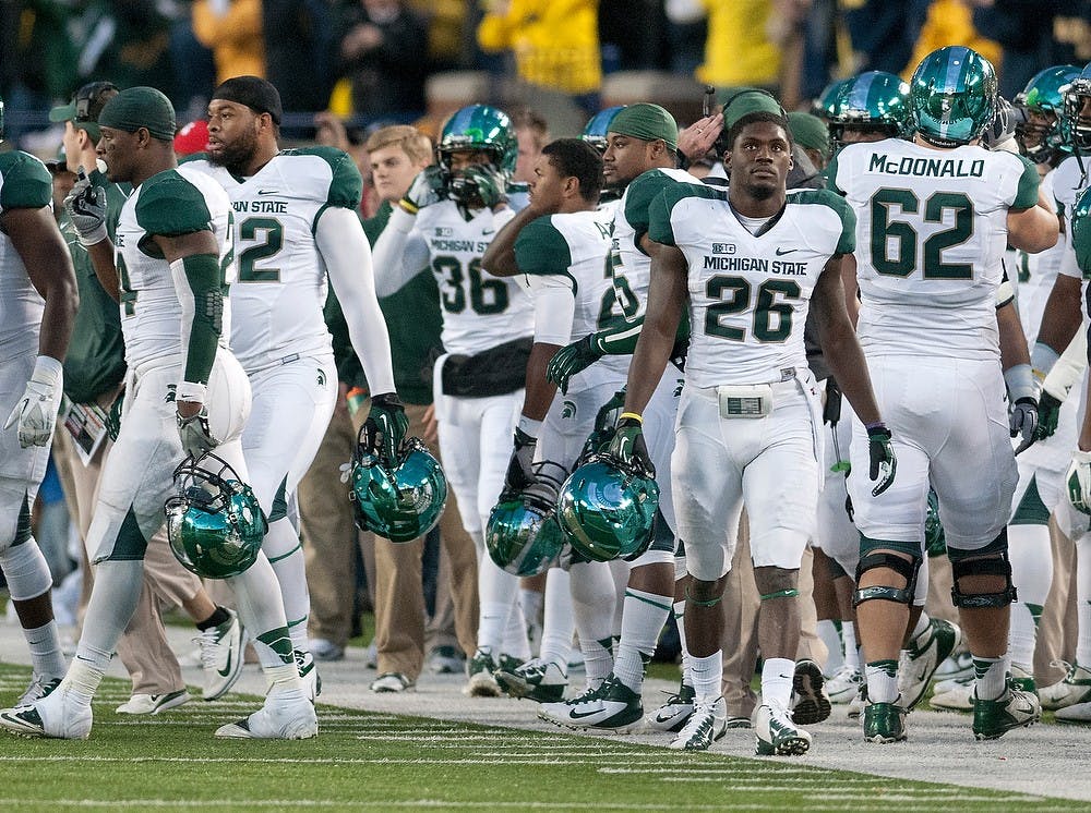 	<p>Michigan State players react after Michigan place kicker Brendan Gibbons makes a game-winning field goal from the 38 yard line. Michigan defeated Michigan State, 12-10, on Saturday afternoon, Oct. 20, 2012, at Michigan Stadium in Ann Arbor, Mich. Justin Wan/The State News</p>