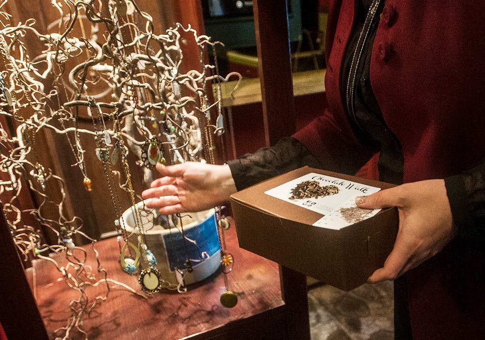 	<p>St. Johns, Mich., resident Mahria Beachnau looks at jewelry at a chocolate walk stop, Feb. 12, 2014, at Tallulah&#8217;s Folly, 1220 Turner Street, during the Old Town Chocolate Walk. Erin Hampton/The State News</p>