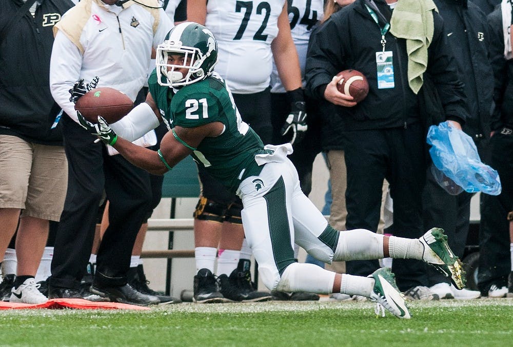 	<p>Sophomore wide receiver Andre Sims Jr. catches a pass from sophomore quarterback Connor Cook during the game against Purdue on Oct. 19, 2013, at Spartan Stadium. <span class="caps">MSU</span> defeated the Boilermakers, 14-0. Danyelle Morrow/The State News</p>