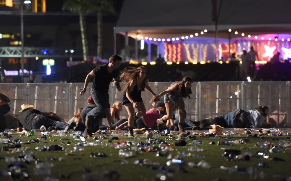 People run from the Route 91 Harvest country music festival after apparent gun fire was heard on October 1 in Las Vegas.  A shooter opened fire from within Mandalay Bay Resort and Casino. David Becker | Getty Images