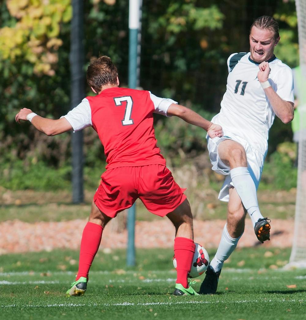 	<p>Ohio State midfielder Zach Mason and junior defender Ryan Keener fight for control of the ball during a game on Oct. 13, 2013, at DeMartin Stadium at Old College Field. The Spartans tied the Buckeyes, 1-1. Georgina De Moya/The State News</p>