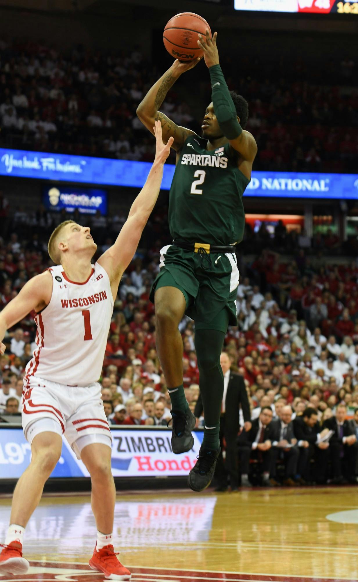<p>Freshman guard Rocket Watts (2) shoots over a defender during the basketball game against Wisconsin on Feb. 1, 2020 at the Kohl Center in Madison, Wisconsin. The Spartans fell to the Badgers, 63-64.</p>