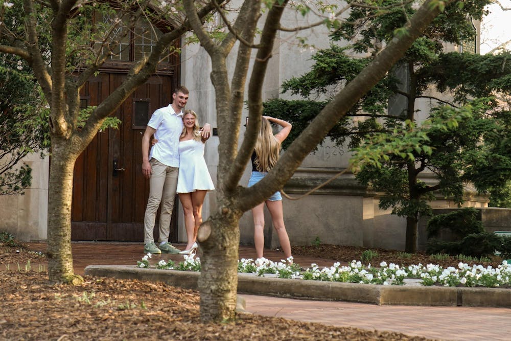 <p>Carson Cooper, a senior on the Michigan State men’s basketball team, and Mara Schrauben pose after getting engaged at Beaumont Tower in East Lansing, Mich., on Thursday, April 24, 2026.</p>