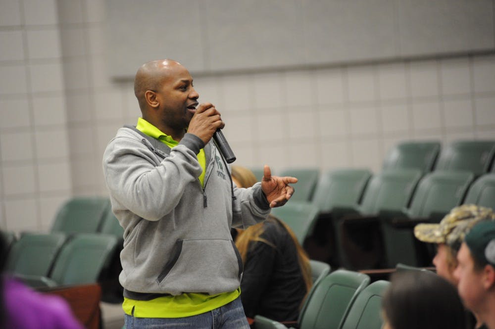 Assistant director of REHS Josh Gillespie speaks to volunteers on April 16, 2016 in classroom b115 in Wells Hall. 