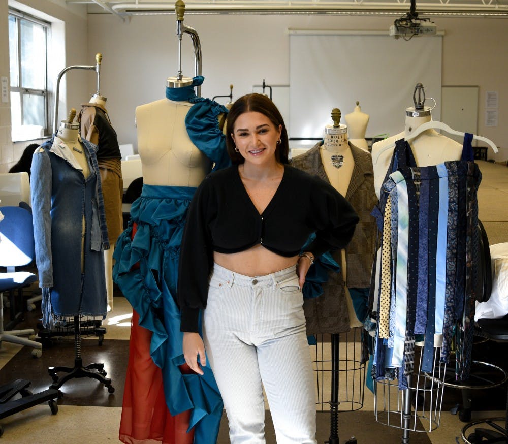 Apparel and textile design major and MSU senior Mikayla Frick poses for a portrait in her studio at the Urban Planning and Landscape Architecture building on October 15, 2019. 