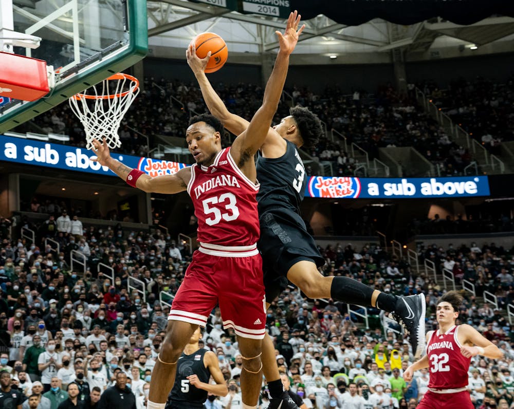 <p>Michigan State freshman Jaden Akins (3) scores while being guarded by Indiana&#x27;s freshman guard Tamar Bates (53) during the Spartans&#x27; victory on Feb. 12, 2022.</p>
