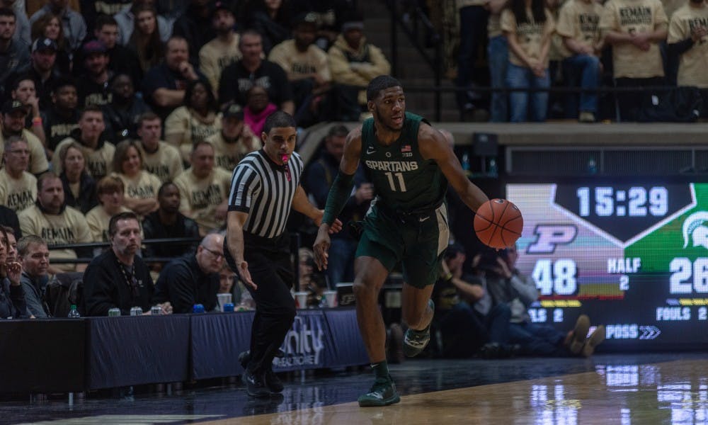 Freshman forward Aaron Henry (11) begins a fast break following a steal at Mackey Arena on Jan. 27, 2019. The Spartans fell to the Boilermakers, 73-63.