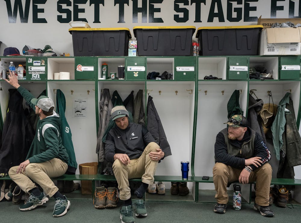 <p>Groundskeepers at the end of their shift, in their locker room under Spartan Stadium on March 31, 2023.</p>