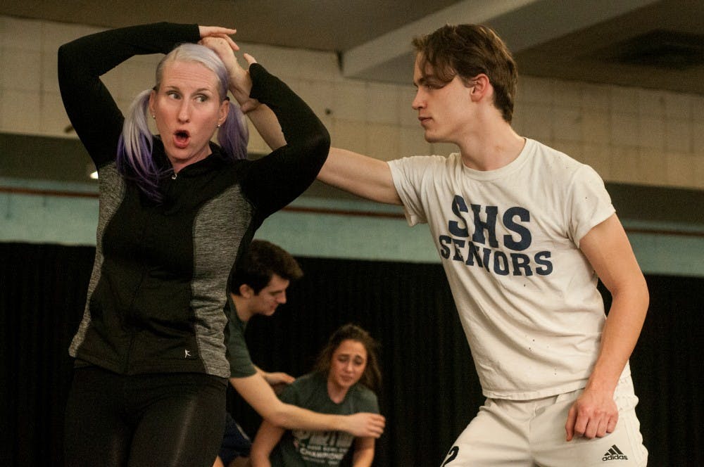 Theatre assistant professor Christina Traister demonstrates some moves with BFA theatre sophomore Mike Merluzzi, as she teaches a stage fight class on Dec. 8, 2015 at IM Sports-Circle. Assistant professor Traister is one of four certified female stage fight directors with the Society of American Fight Directors. 