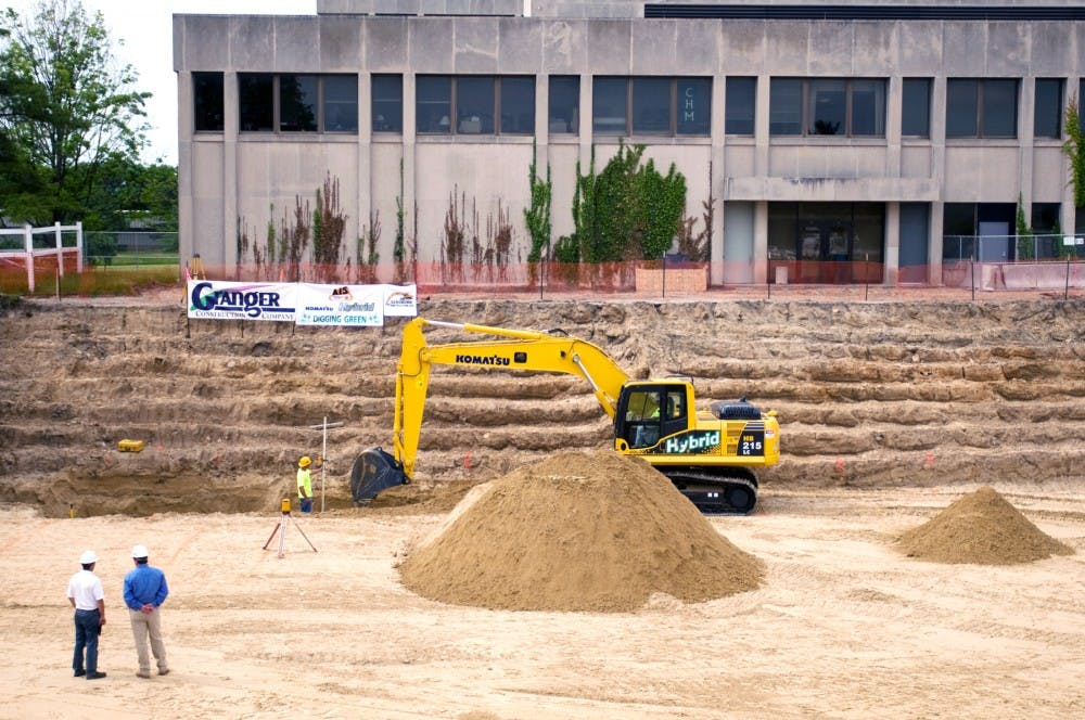 	<p>The construction site near Life Sciences boasts a hybrid backhoe made by Komatsu, which runs on a combination of diesel fuel and electric energy. The hybrid equipment is the first of its kind, allowing <span class="caps">MSU</span> to &#8220;dig green&#8221;. Kat Petersen/The State News</p>