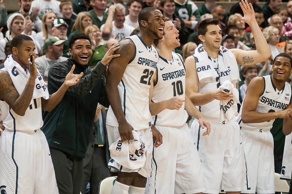 	<p>Players on the bench react after a play on the court during the game against Mount St. Mary&#8217;s on Nov. 29, 2013, at Breslin Center. The Spartans defeated the Mountaineers, 98-65. Khoa Nguyen/The State News</p>