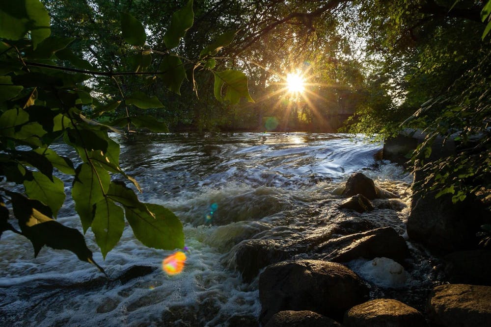 The sun rises over the Red Cedar River on MSU campus Sep 27, 2021. Photo courtesy of Bugsy Sailor
