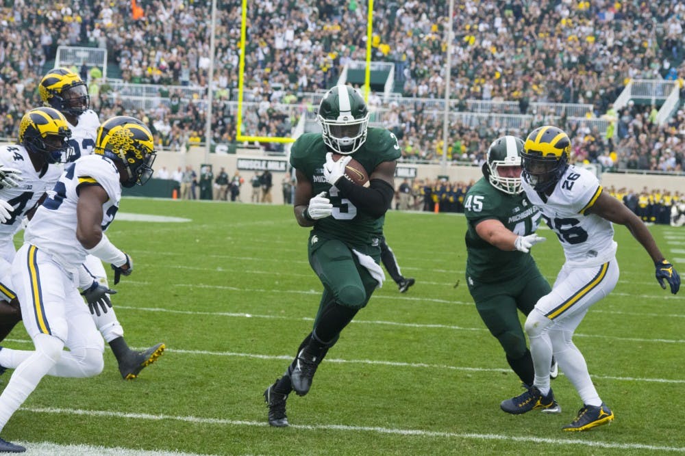 Sophomore running back LJ Scott (3) runs into the end zone during the game against Michigan on Oct. 29, 2016 at Spartan Stadium. The Spartans were defeated by the Wolverines, 32-23.  