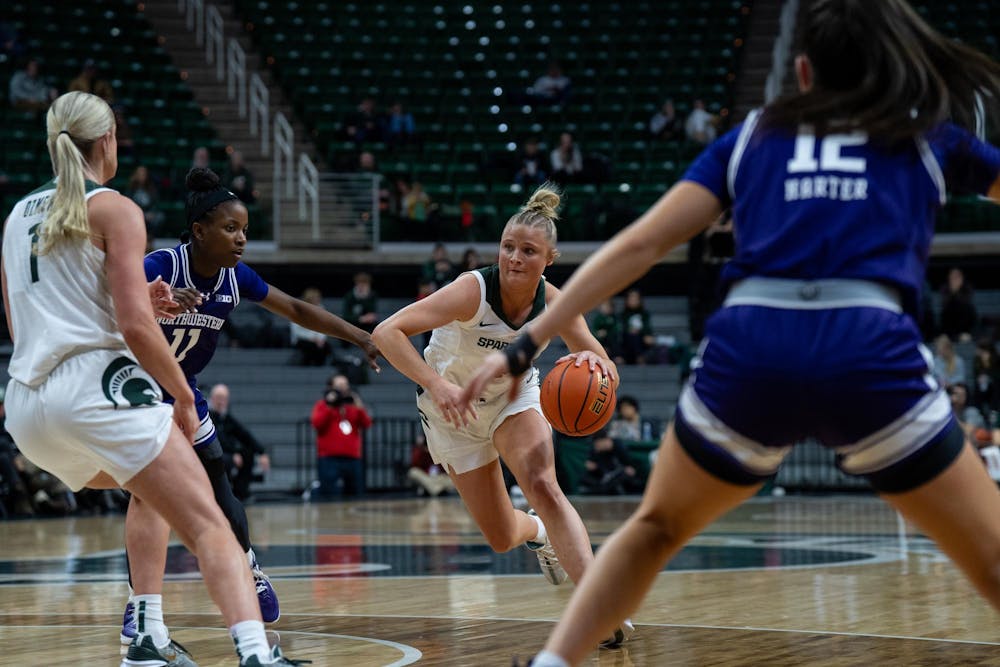 Michigan State University sophomore guard Theryn Hallock (4) dribbling the ball at the game against Northwestern University at the Breslin Center on Jan. 17, 2024.
