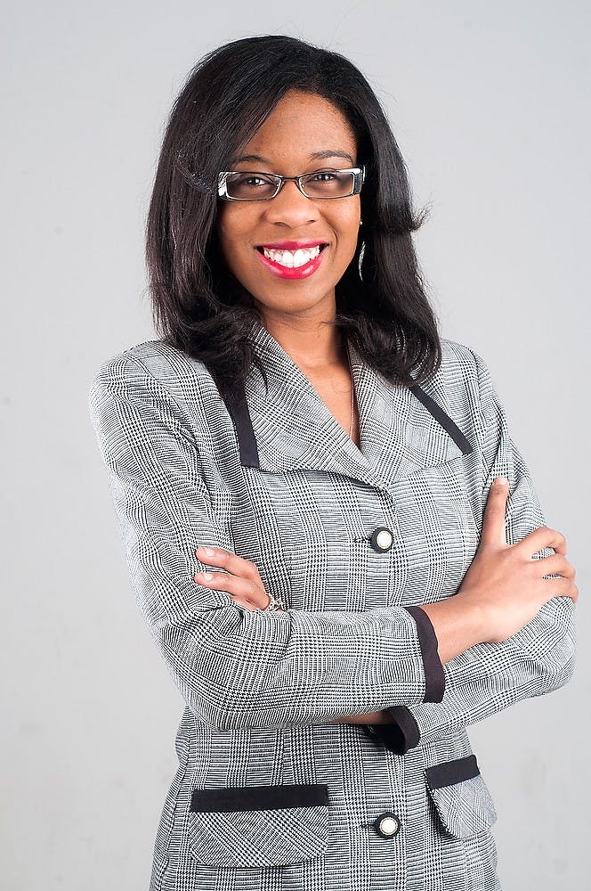 <p>Journalism senior Micayla Cummings poses for a portrait Dec. 2, 2014 at The State News. Jessalyn Tamez/The State News </p>