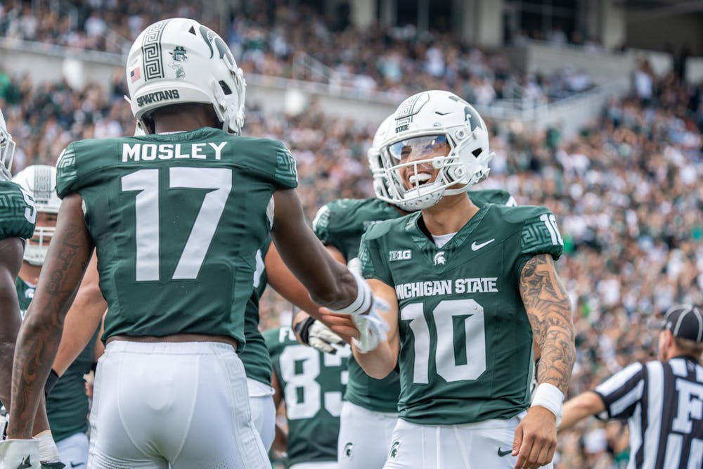 <p>Quarterback Noah Kim (10) congratulates wide receiver Tre Mosley (17) after he scored a touchdown during a game against Richmond at Spartan Stadium on Sept. 9, 2023. The Spartans ultimately defeated the Spiders 45-14.</p>