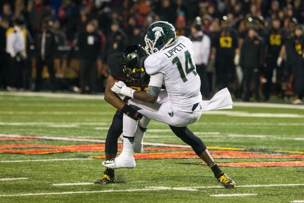 <p>Then-University of Maryland defensive back Sean Davis tackles then-senior wide receiver Tony Lippett during Maryland&#x27;s game against Michigan State on Nov. 15, 2014 at Byrd Stadium. Photo courtesy of Marquise McKine/The Diamondback</p>