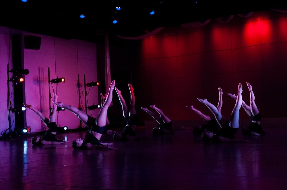 	<p>Students of the Orchesis dance program perform during the Repertory Dance Concert, in the <span class="caps">RCAH</span> theatre on Jan. 30, 2014. The piece, &#8220;Into Her Own&#8221; was one of six dances to comprise the concert. Casey Hull/The State News</p>