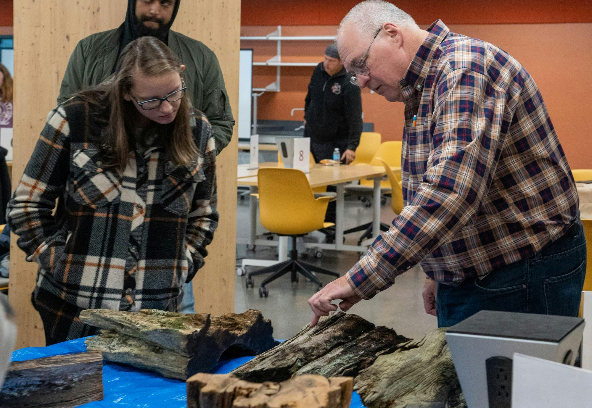 <p>Sean Dunham speaks on the trees that have been surrounded by fire at some point at the forest and fire management event held at the Stem Building on Oct. 14, 2023.</p>