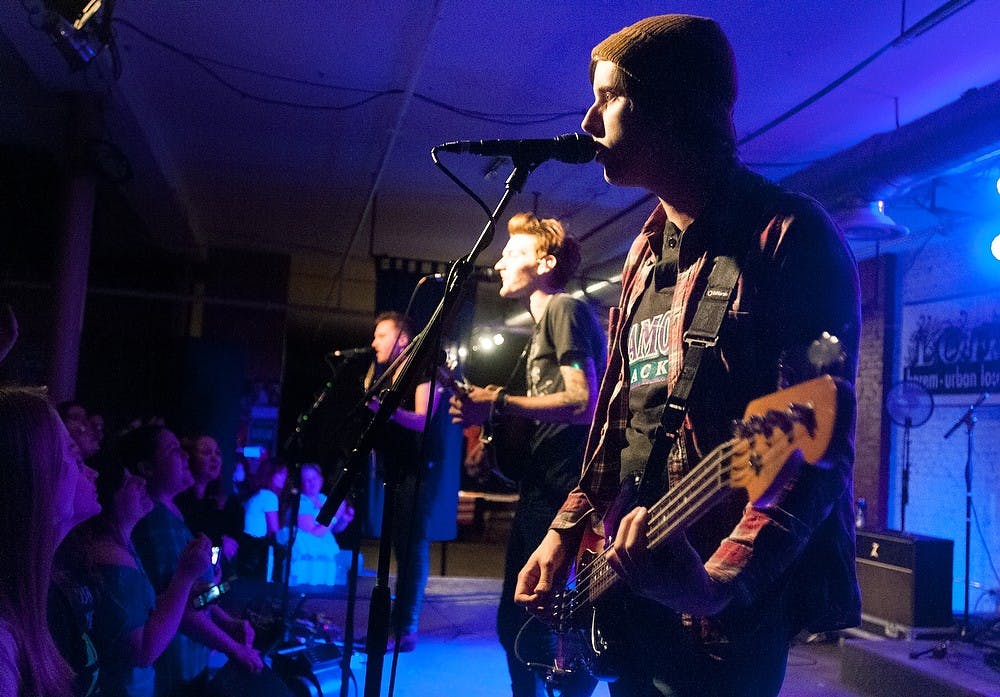From right to left, A Rocket To The Moon bassist Eric Halvorsen sings along with lead singer Nick Santino and guitarist Justin Richards on Saturday at The Loft, 414 E. Michigan Ave., in Lansing. Katie Stiefel/State News
