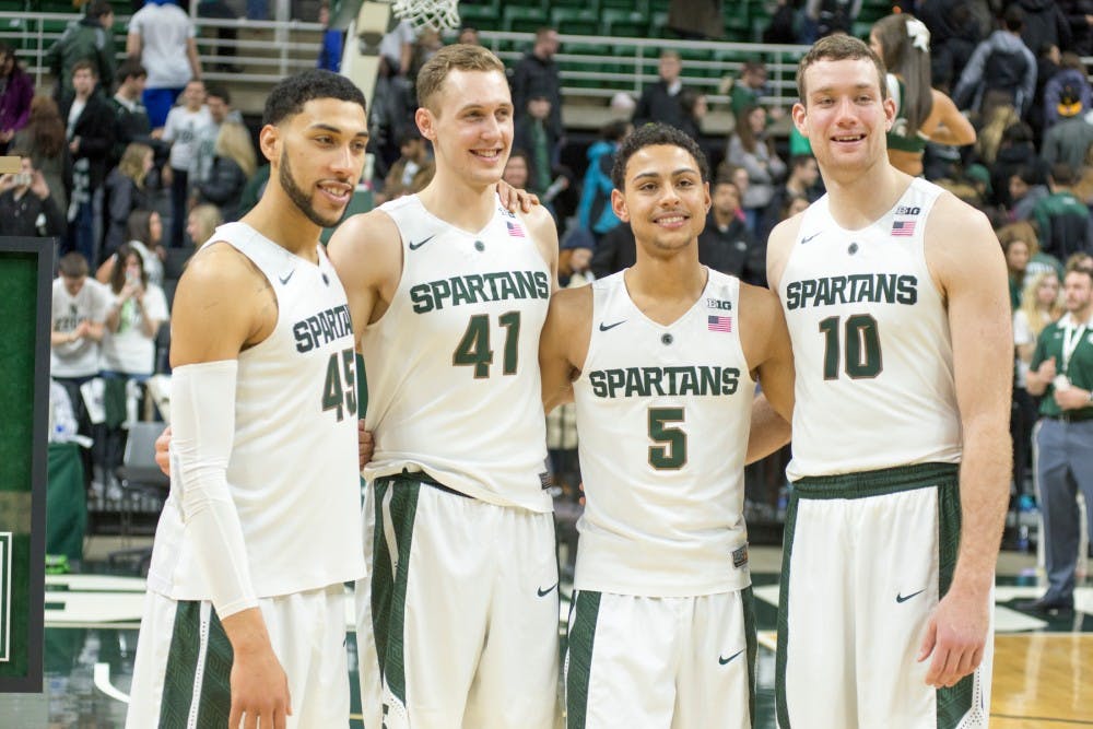 From left to right, senior guard Denzel Valentine, senior forward Colby Wollenman, senior guard Bryn Forbes and senior forward Matt Costello pose for a picture after the game against Ohio State on March 5, 2016 at Breslin Center. The Spartans defeated the Buckeyes, 91-76.