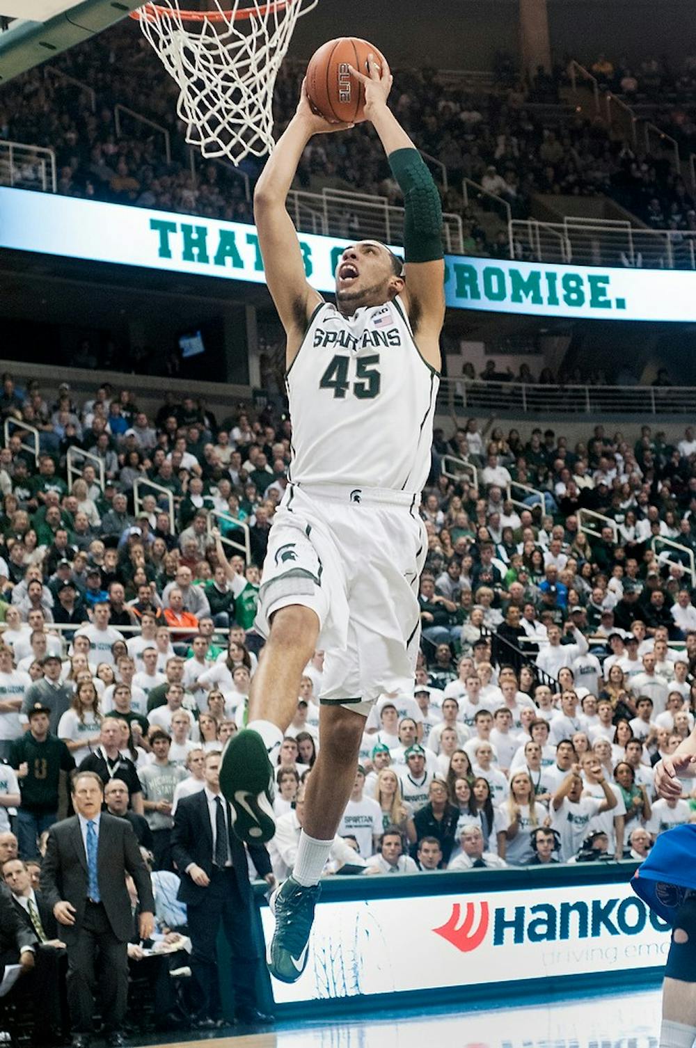 	<p>Freshman guard Denzel Valentine dunks the ball during the game against Boise State on Nov. 2012, at Breslin Center. The Spartans beat the Broncos, 74-70. Adam Toolin/The State News</p>