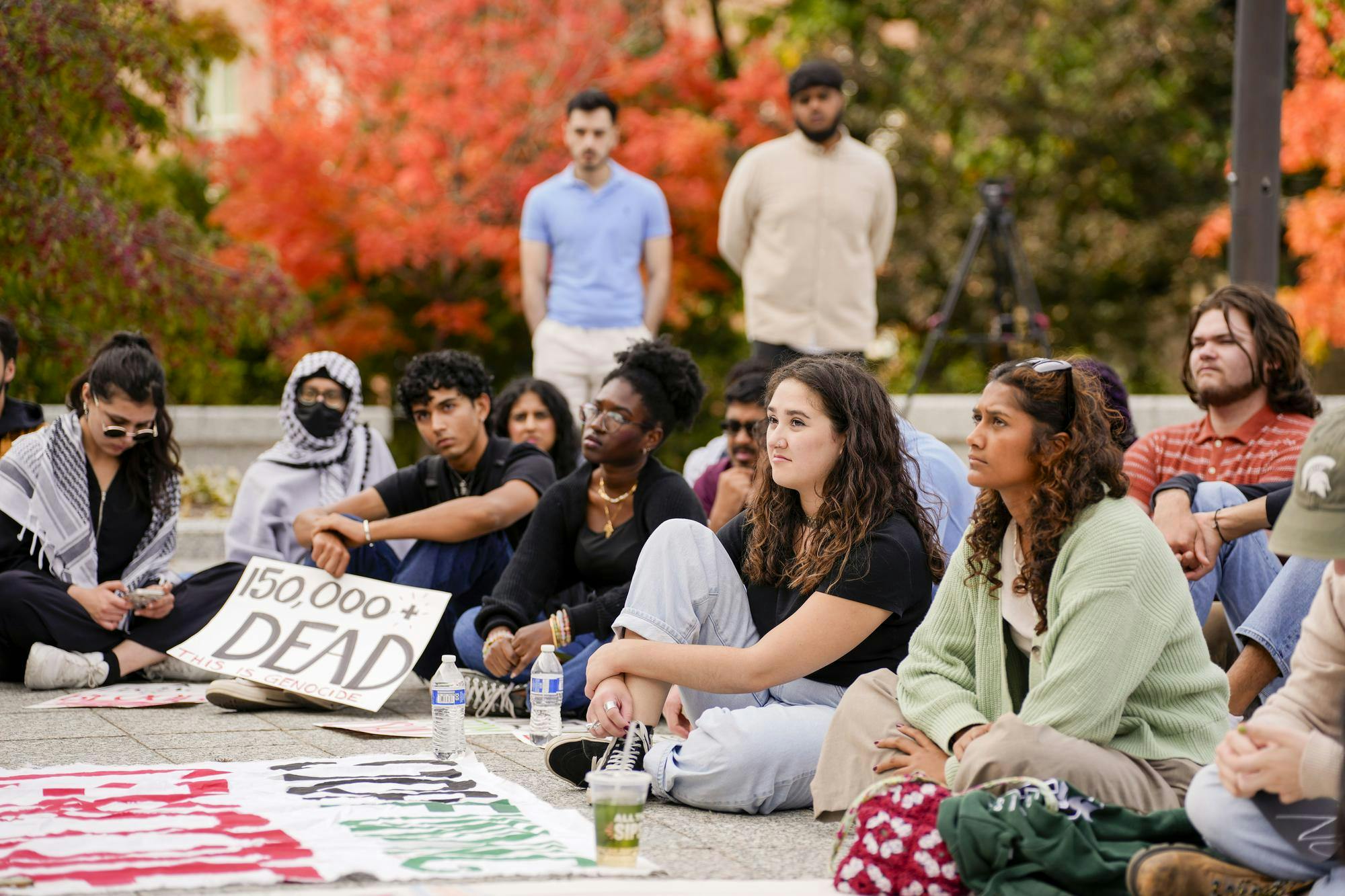 <p>Michigan State University students in the Students for Justice in Palestine organization sit outside of the Hannah Administration building as they listen to professors and guest speakers talk about the Israel-Hamas war on Oct. 11, 2024. These students are attending a study-in and walk-out, protesting MSU’s investments in Israel.</p>