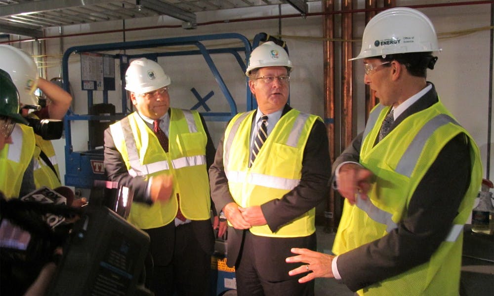 <p>From left to right, Mark Burnham, vice president of governmental affairs for MSU, Sen. Gary Peters (D.-Mich.) and Paul Mantica, deputy laboratory director and deputy project manager, tour FRIB on Sept. 21, 2015. Alex Kurrie/The State News</p>