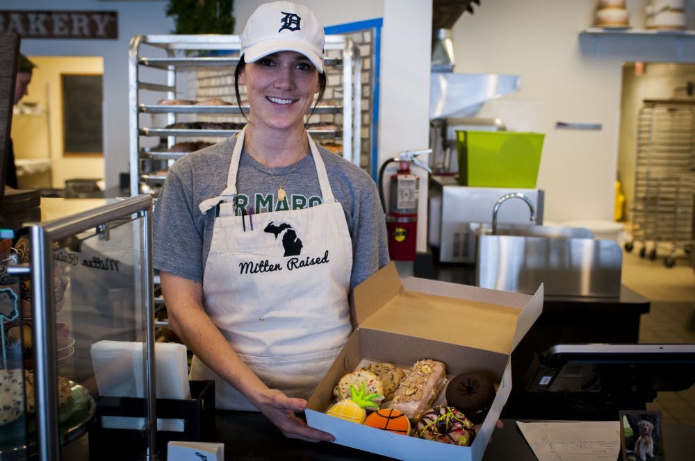 <p>Owner Katie Anne Lambert shows off some of her delicious creations on Feb. 11, 2018 at Mitten Raised Bakery. Mitten Raised moved from its Okemos location to 1331 Grand River Ave., East Lansing, Mich. (C.J. Weiss | The State News)</p>